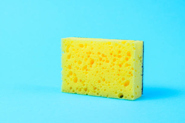 One yellow wash sponge on blue background.